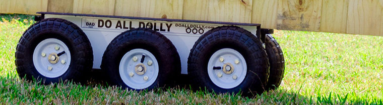 Dolly wheels on a truck in the grass.