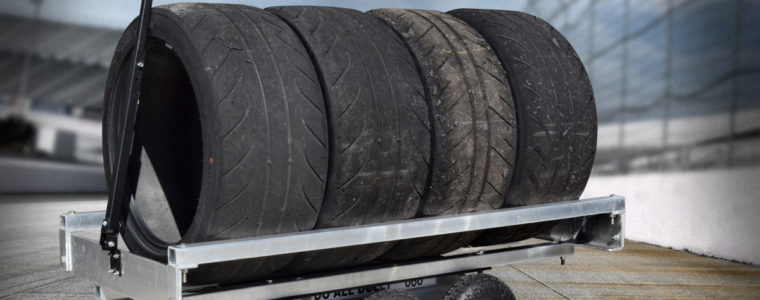 A trailer with tires on it is shown.