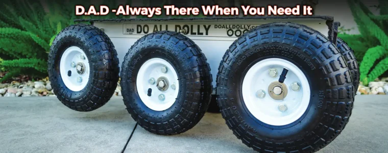 Three tires are lined up on the sidewalk.